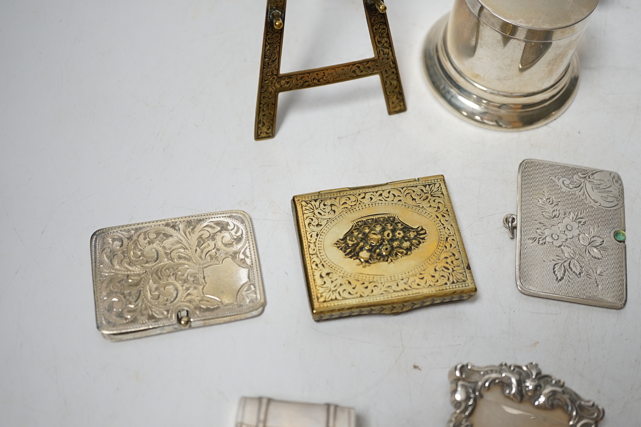 An Edwardian engraved silver combination stamp box/vesta case, Birmingham, 1906, 48mm, a similar silver slide action stamp case and seven other items including white metal box and sterling dispenser, etc.